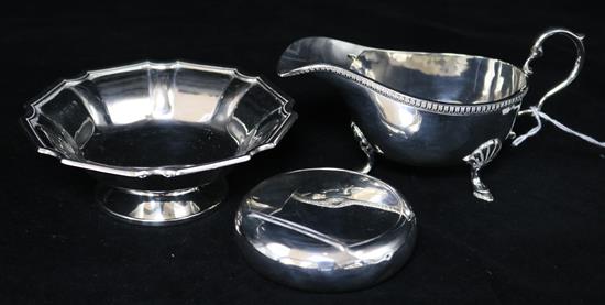 A silver cream jug, silver footed dish & silver tobacco box.